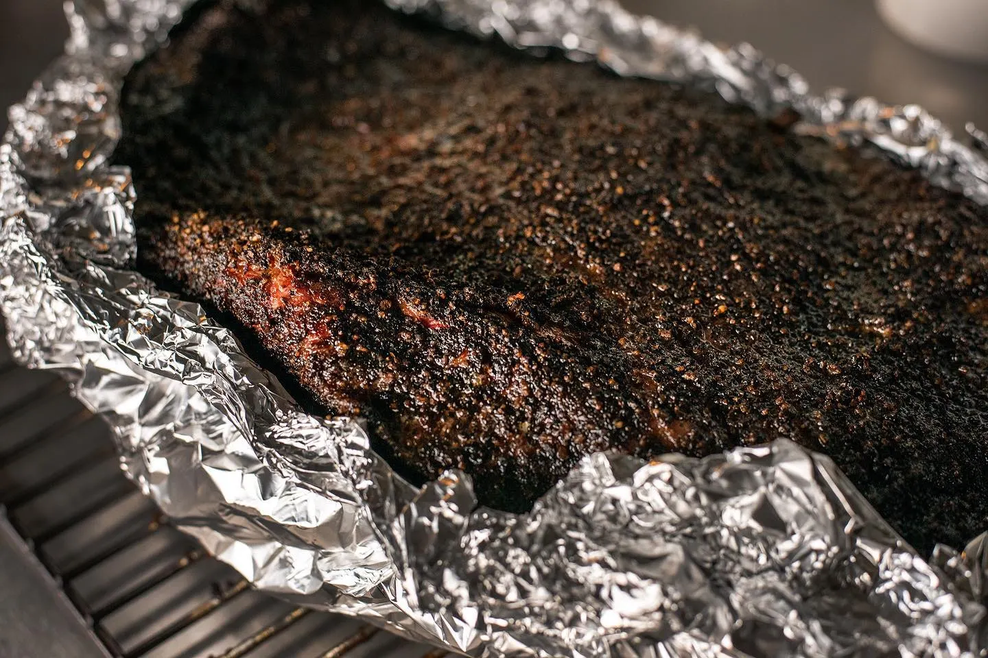 Macro of the dark bark on a smoked brisket